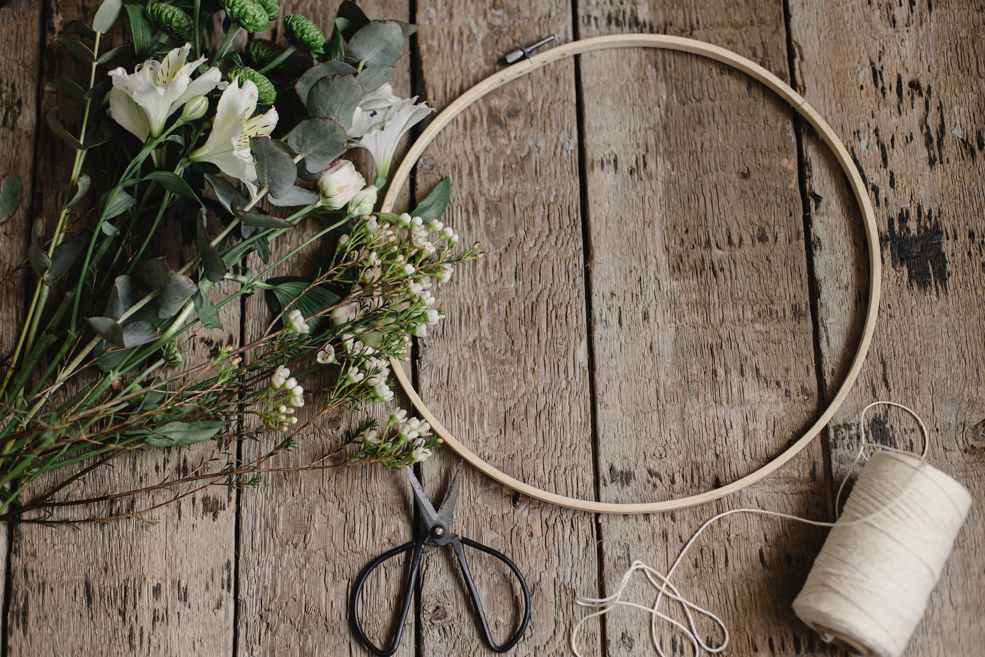 floral hoop composition on table