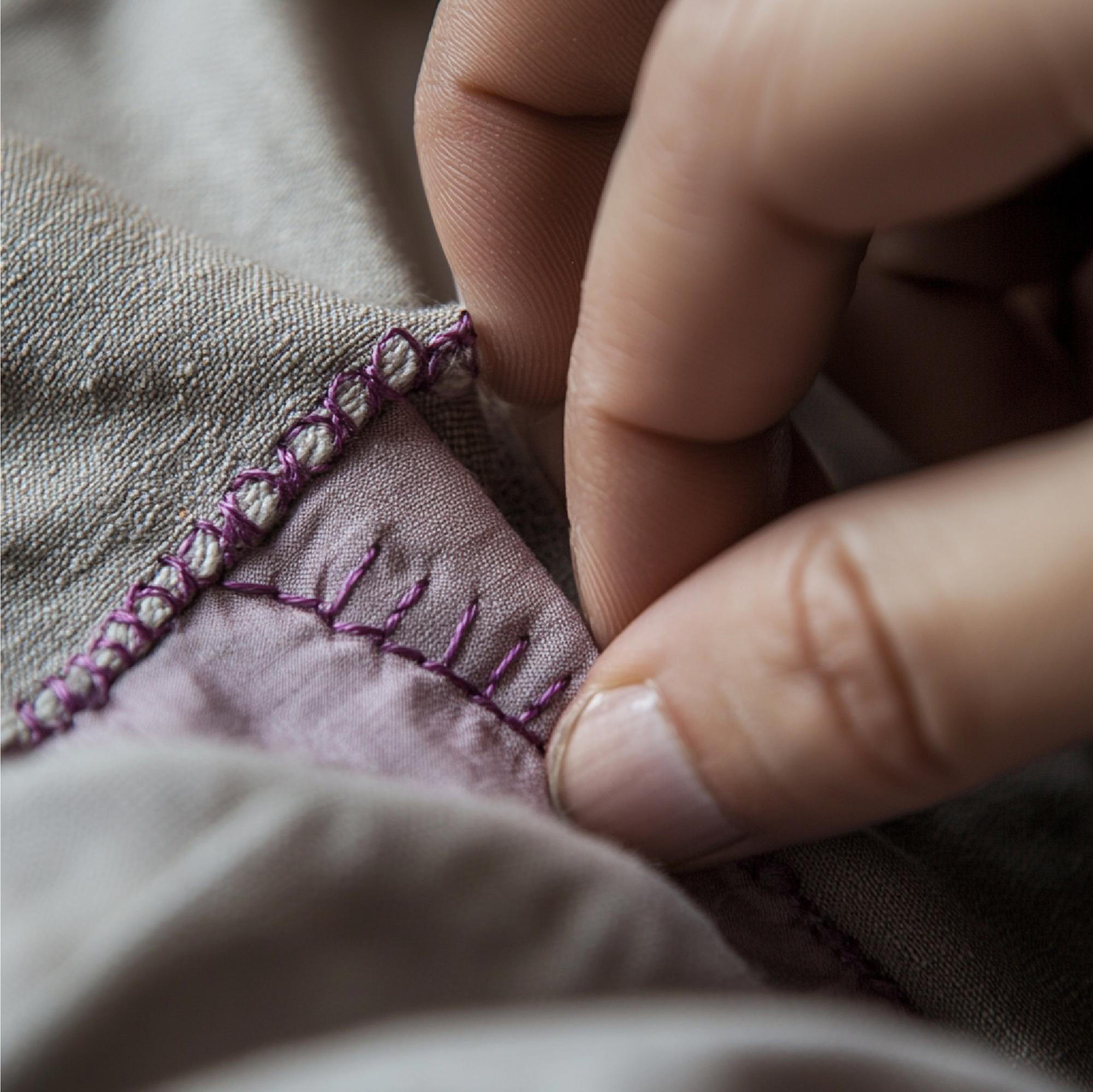 artisan stitching close-up on linen
